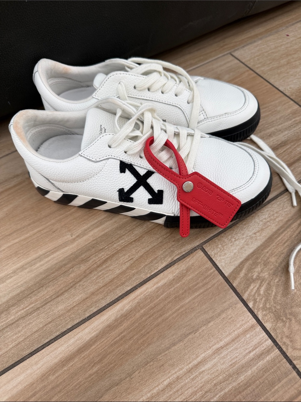Off-White Women’s White Sneakers with Black Arrow and Red Tag